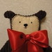 Soft MInky Huggable Bear with stitched face, red bow and added stitched heart