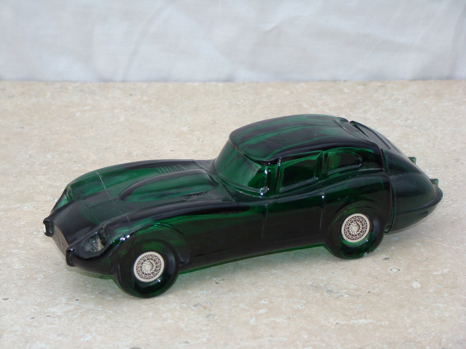 Items similar to Avon Car Bottle / Jaguar Decanter / Green Glass Bottle