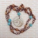 Celtic Horse Pendant with Wooden and Crackled Turquoise colored bead necklace 21inches