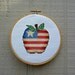 Hoop Art apple red white blue star completed cross stitch