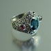 SOGDIANA silver ring with London Blue Topaz and Garnet