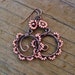Bead Dance earrings in Cheyenne Pink - wire wrapped antiqued copper hoops with seed beaded petals