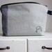 Short haired girl a zipper pouch