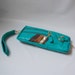 9 pocket Vigga clutch in aquamarine w/cheetah printed liner