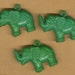 vintage celluloid elephant charms, three pieces, green