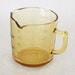 Antique Amber Glass Embossed Three Spout Measuring Cup 3.5 Inches Tall
