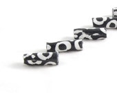 Fiber Beads Textile Beads Fabric Beads with White Loops on a Black Background