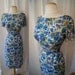 Sweet 1950's aqua blue floral print silk wiggle day to cocktail dress with pom pom ball details rockabilly vlv chic - size Medium