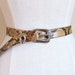 FINAL SALE////vintage 1960s real snakeskin belt with silver tone grommets