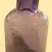 Miniature tiny 1/2 oz. Antique DEEP PURPLE APOTHECARY bottle, over 100 years old.