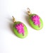 A pair of earrings embossed pink rose on pistachio green with gold plated metal ( resin rose cabochon,pink , green, gold plated , earrings)