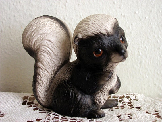 ceramic skunk figurines