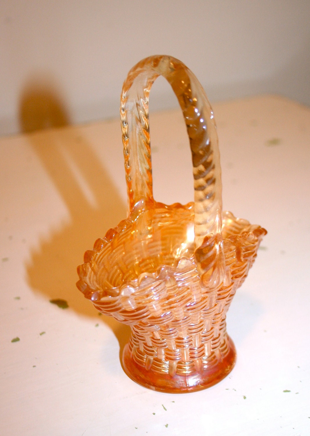 Vintage small peach carnival glass brides basket with handle