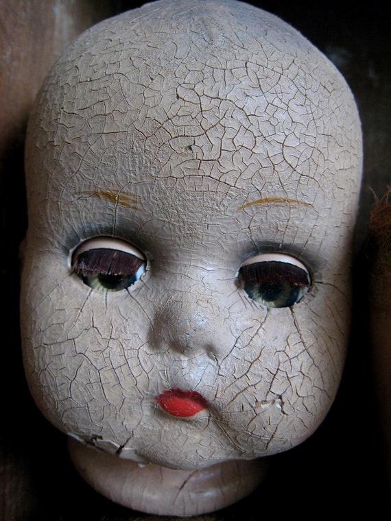 creepy wooden doll