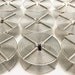 Set of 9 heavy duty stainless steel 35 mm developing reels marked Hewes British Made