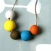 not quite round handmade beads make a necklace