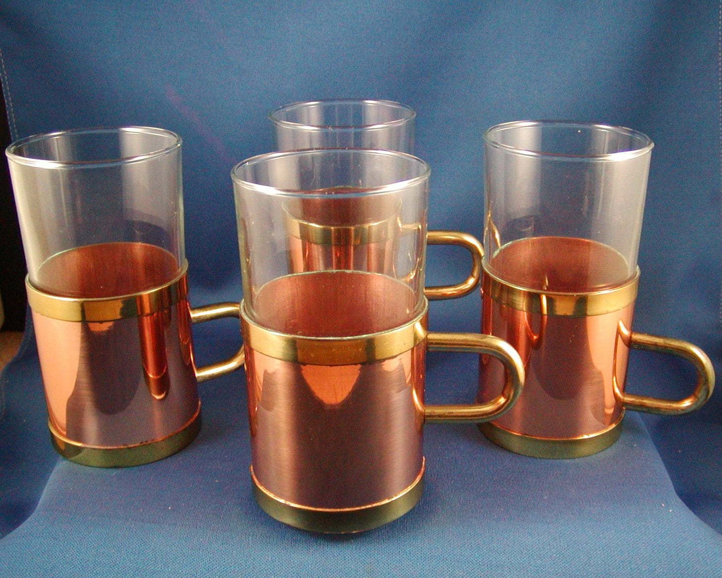Glass mug with metal holder