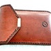 Brown suede lined leather smartphone case with belt loop.
