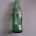 Old Coke Bottle - green swirl glass