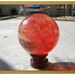Crystal ball: large red glass sphere
