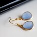 Ice blue crystal earrings, blue opal glass earrings, small gold earrings, simple everyday jewelry