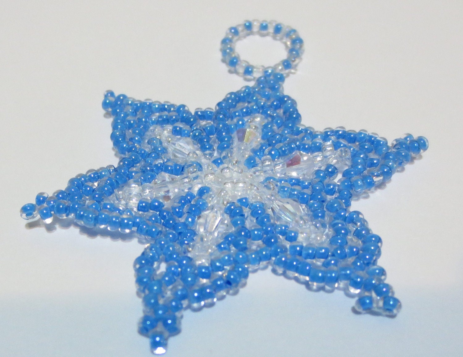 Bead and crystal snowflake ornement .