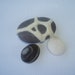 Felted ocean rock in white. Surf polished stones smoothed by the highest tides in the world