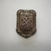 Vintage Marcasite Dress Clip marked Sterling One stone missing.