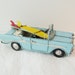 Sky blue convertible Chevrolet miniature with two surfboards, vintage tin Chevy miniature, Chinese, antique car replica, early nineties