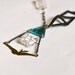 Quartz, blue glass and leather geometric swallow gemstone statement necklace.