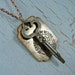Long skeleton key necklace with vintage postal tag