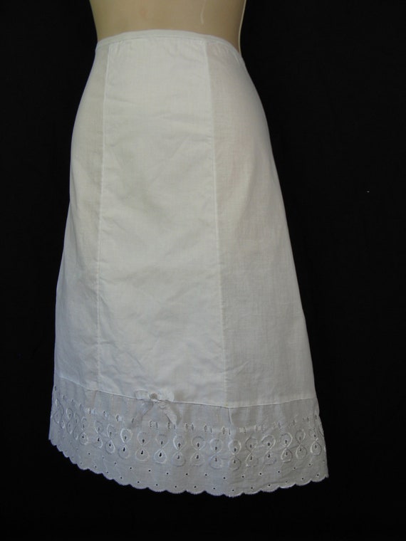 1950's lace slip. white cotton eyelet ribbon hem. half