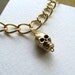Gold skull charm bracelet on 14k gold plate chain, thick gold chain