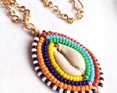 Items similar to MAASAI LOVELY AMULET - Cowrie Shell Wrapped Necklace