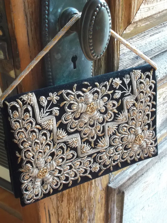 black embroidered clutch bag