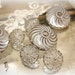 vintage glass buttons with luster . milk glass with silver luster . clear with silver . 2 sets