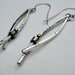 long silver earrings with bronze accents aka norwegian woods