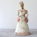 Antique Chalkware Girl with Muff and Bustle