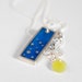 That Feeling necklace in blue resin and sterling silver, dots