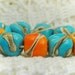 Lampwork bead set (9), freeform pebbles, turquoise, orange, silvered ivory, SRA