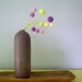 Yarn pom poms bouquet. Felt flowers for childrens room. Purple and lemon yellow blooms. Royal princess.y