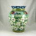 Large blue handmade porcelain vase with white flowers