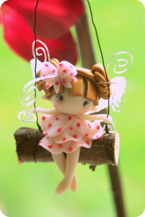 fairy on a swing figurine