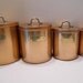 Copper and Aluminum Canister Eight Piece Set with Brass Labels and Brass Handles