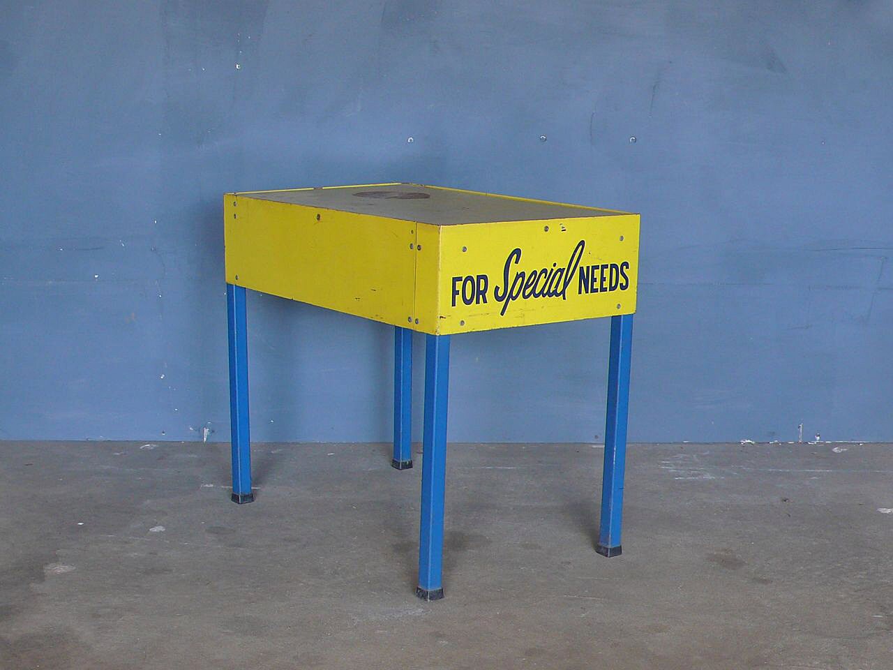 Bright vintage metal side table display stand.