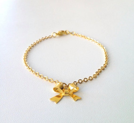 Items similar to PETITE BOW 14K Gold Petite Bow Bracelet on Etsy
