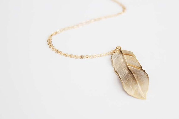 https://www.etsy.com/listing/104247208/long-feather-necklace-gold-flowing?ref=favs_view_4