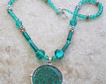Teal pheasant pendant necklace with silver accents