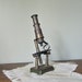 Vintage brass microscope steampunk home decor - antique with articulating magnifying glass victorian early