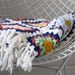 vintage. crochet. white granny square. blanket. throw. afghan. rainbow. colorful. bright.